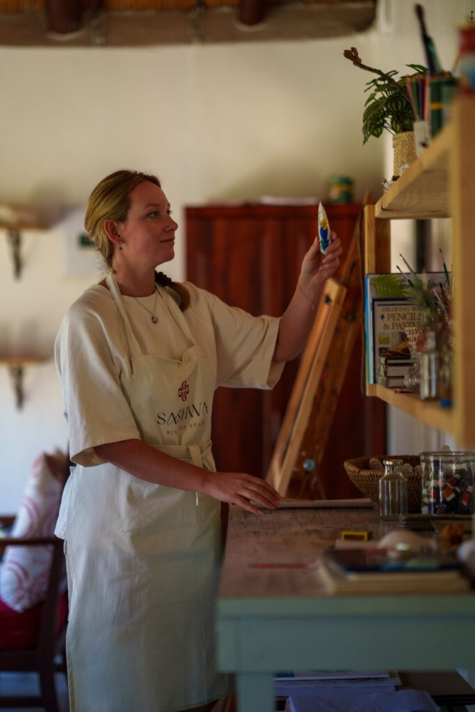 A woman painting in our creative art studio