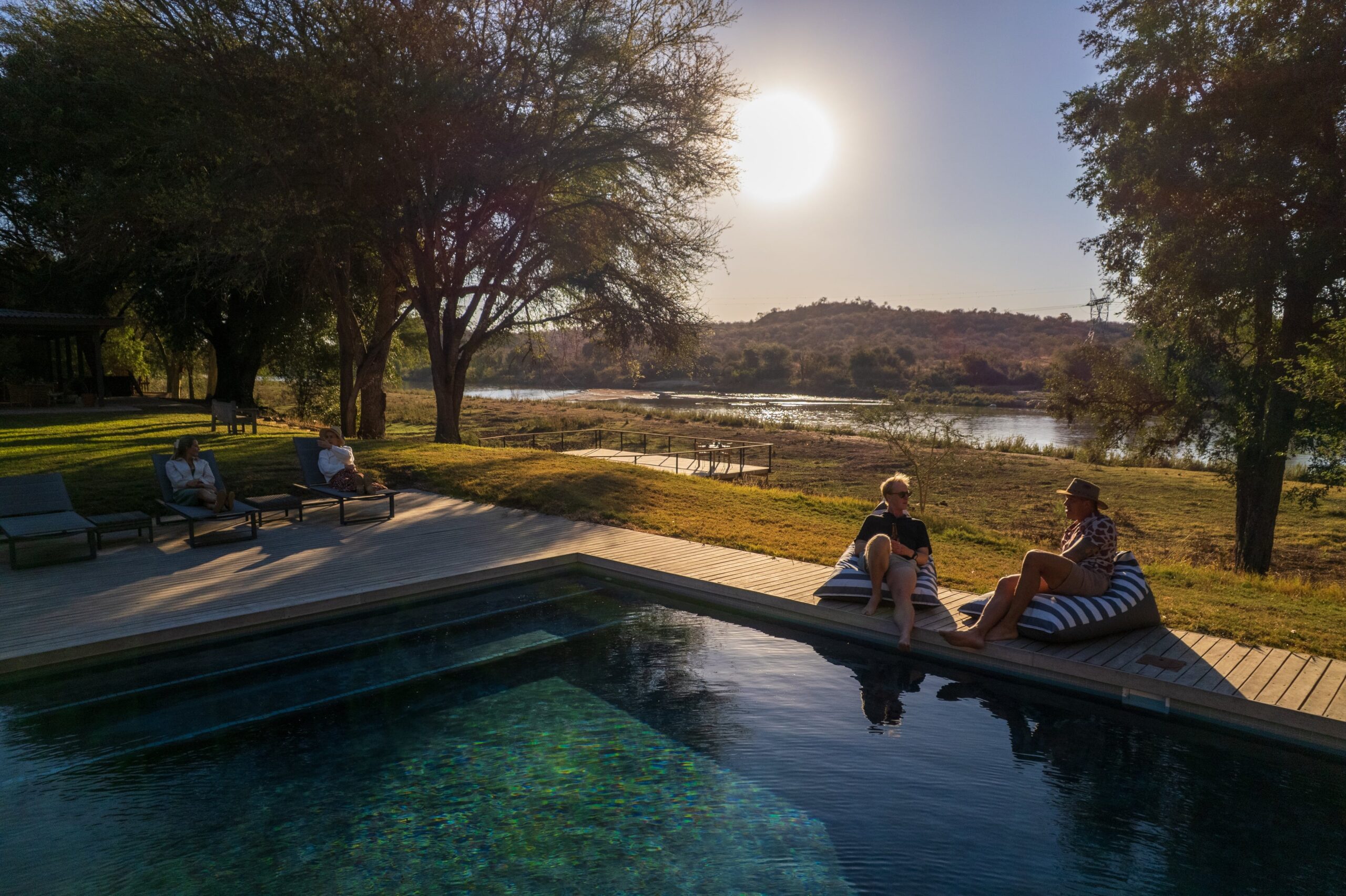 People at the swimming pool overlooking the olifants river